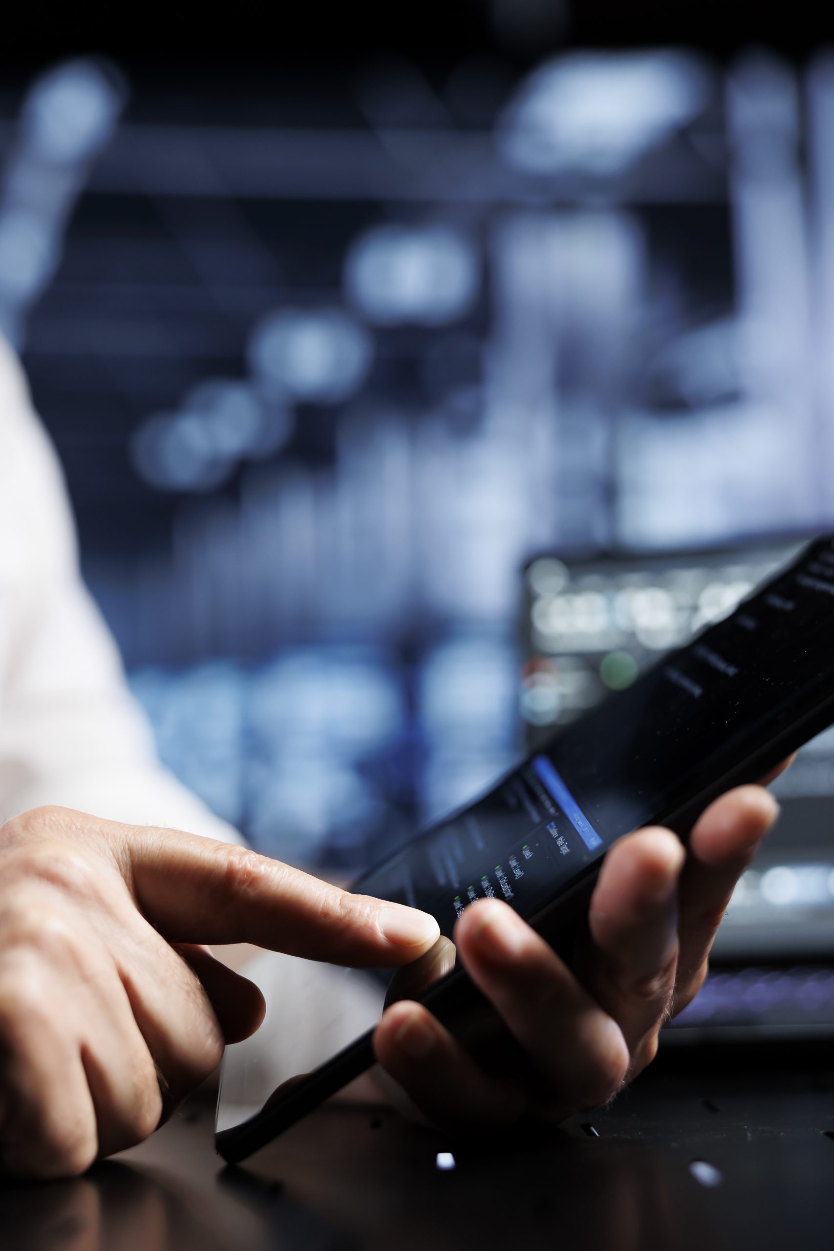 Serviceman coding in data center Serviceman coding in high tech data center using javascript language, close up. Meticulous repairman updating software on server rigs on tablet terminal, ensuring optimal performance and security